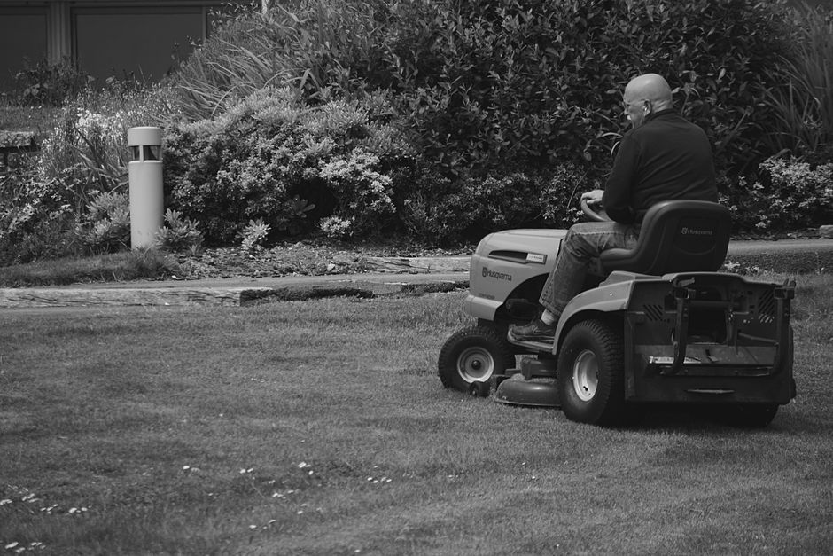 Riding lawn mower in action